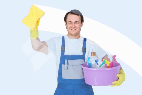 Domestic cleaner tidying a family home in Edgware
